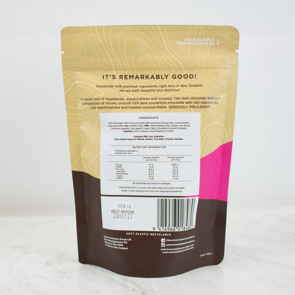 Back view of a dark chocolate bark pouch packaging, featuring a gold and brown design with a pink accent, a white ingredient list, and a resealable zipper.