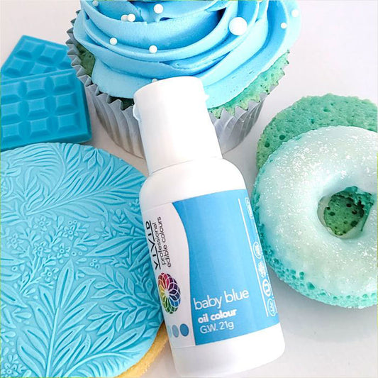baby blue oil food colour surrounded by blue coloured treats and desserts