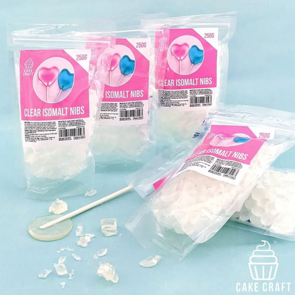 Clear Isomalt Nibs on display with lollipop and isomalt shards laid out