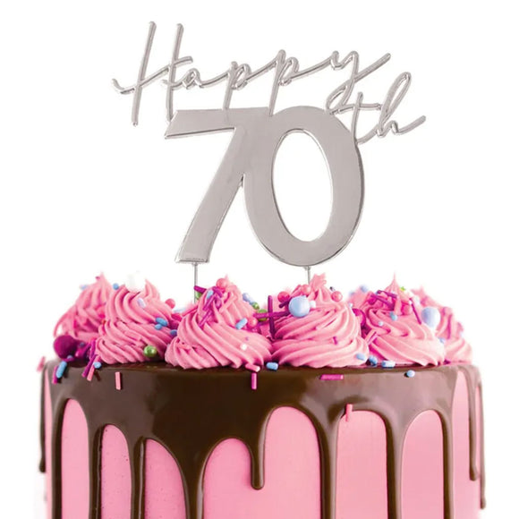 Cake Craft Happy 70th Silver Metal Cake Topper placed on a pink cake with chocolate cake drip