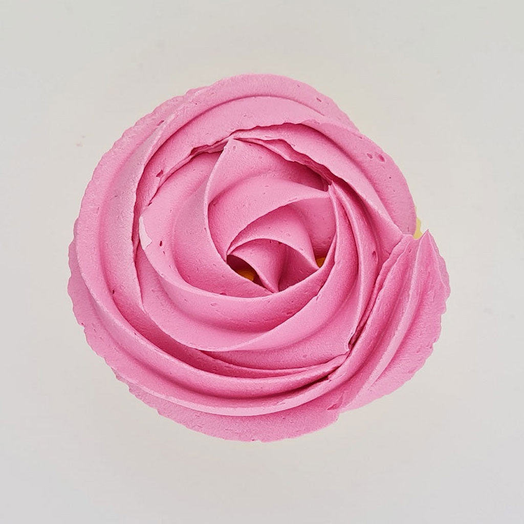 pink buttercream rose piped on to a muffin using the gobake baby pink gel colour