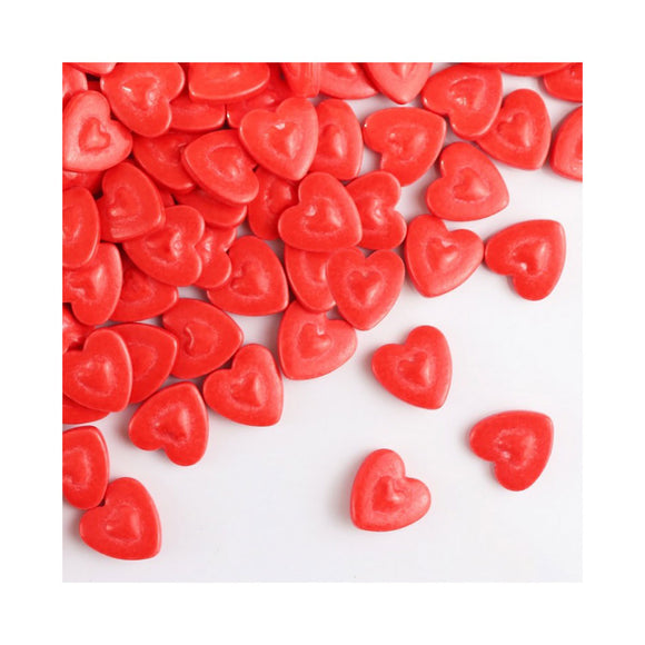 jumbo candy heart sprinkles scattered on a white background