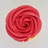 pink buttercream rose piped on to a muffin using the gobake coral pink gel colour