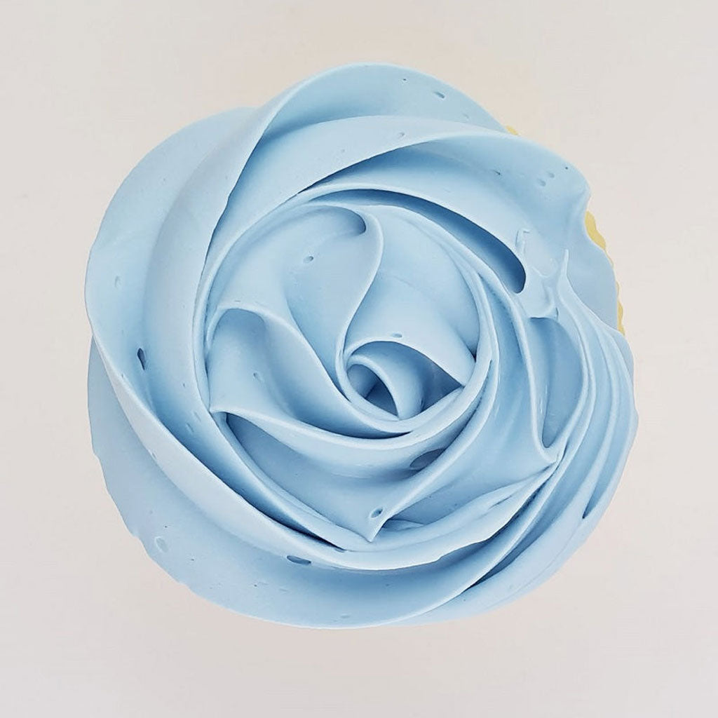 blue buttercream rose piped on to a muffin using the gobake duck egg blue gel colour