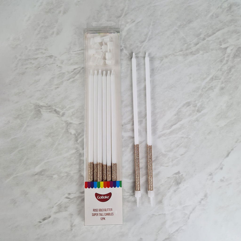 gobake rose gold glitter dipped super tall white candles 18cm and candle holders with example beside packaging on marble background