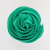 green buttercream rose piped on to a muffin using the gobake green quartz gel colour