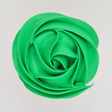 green buttercream rose piped on to a muffin using the gobake Kelly green gel colour