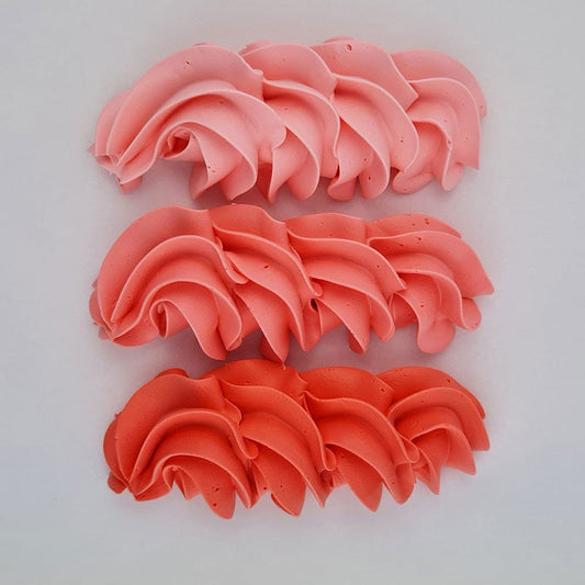 buttercream colour examples of the peachy pink gel colour on a white background