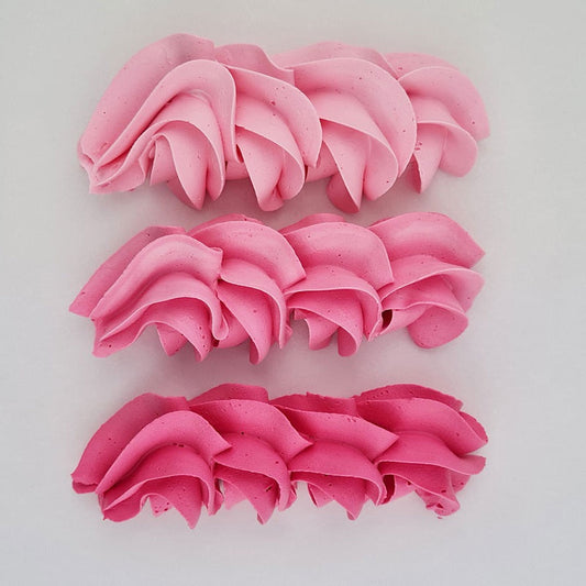 buttercream colour examples of the pink Charlotte gel colour on a white background