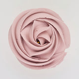 pink buttercream rose piped on to a muffin using the gobake rose quartz gel colour