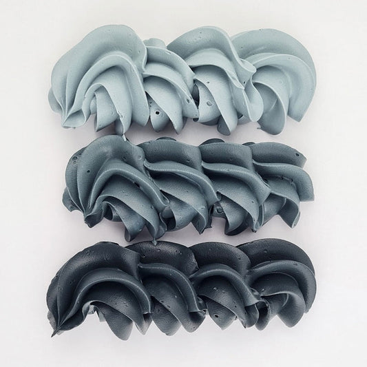 buttercream colour examples of the super black gel colour on a white background