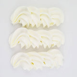 buttercream colour examples of the super white gel colour on a white background