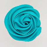 teal buttercream rose piped on to a muffin using the gobake teal gel colour