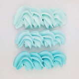 buttercream colour examples of the Tiffany blue gel colour on a white background