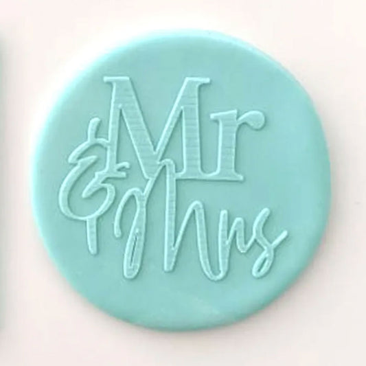 mr & mrs pattern from debosser on round circle of blue fondant
