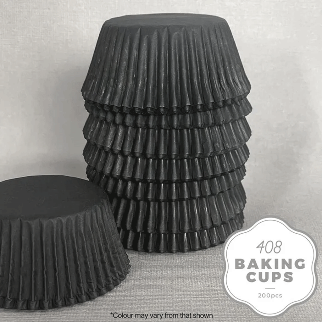 black paper baking cups stacked upside down on a grey background