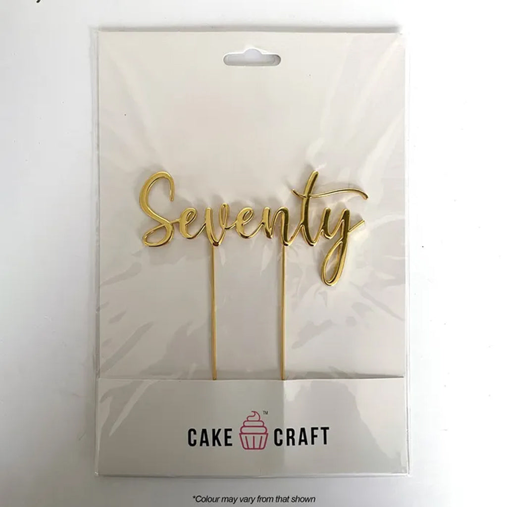 Gold cursive 'Seventy' cake topper in its original white packaging card, featuring the 'Cake Craft' brand logo.