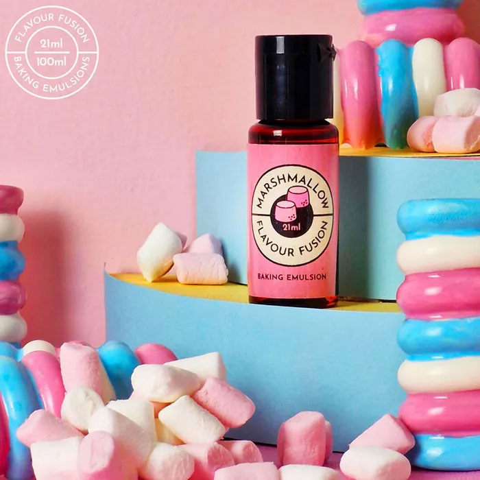 vivid marshmallow flavouring in pink bottle surrounded by little white and pink marshmallows