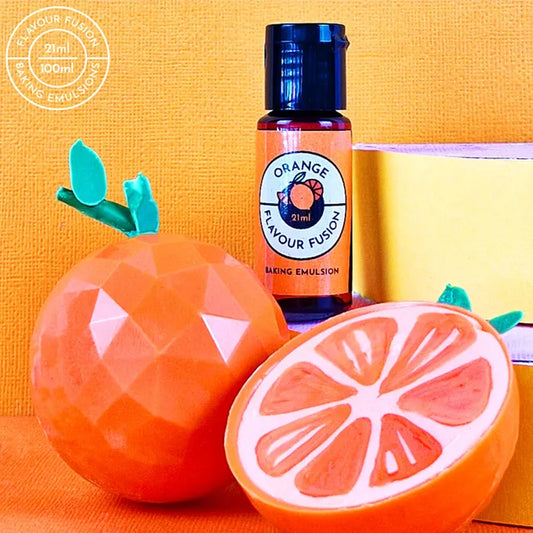 A bottle of Vivid Orange Flavour Fusion beside chocolate candy oranges with an orange background