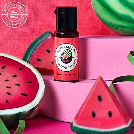Bottle of Watermelon Flavour Fusion baking emulsion with watermelon slices on a pink background