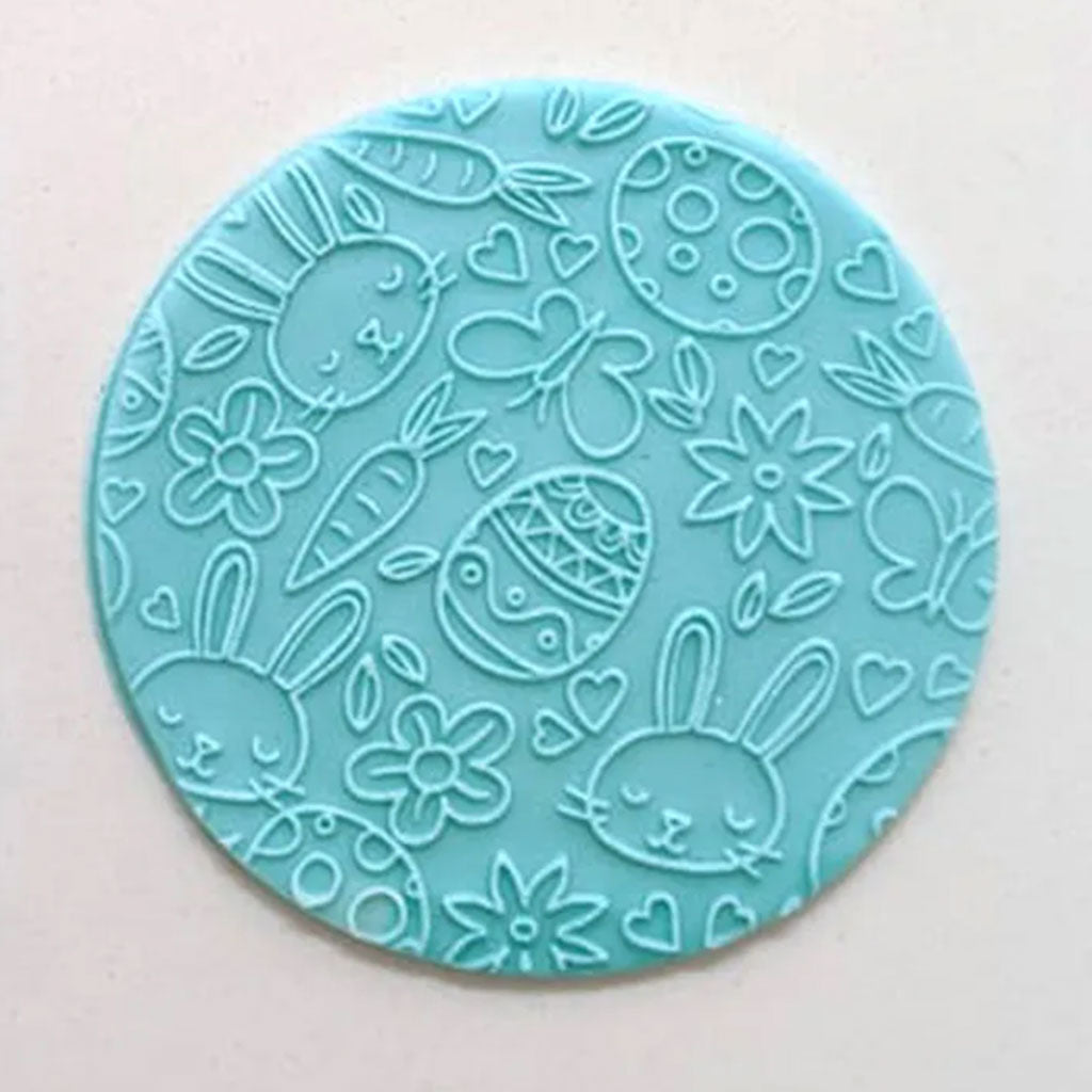 bunny & egg pattern from debosser on round circle of blue fondant