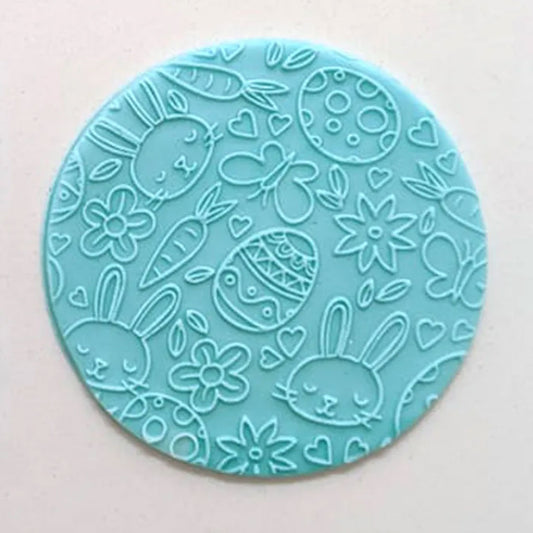 bunny & egg pattern from debosser on round circle of blue fondant