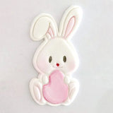 white bunny with pink egg made from icing using bunny and egg cutter and embosser and painted