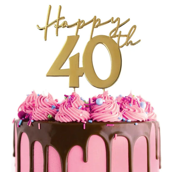 Cake Craft Happy 40th Gold Metal Cake Topper placed on a pink cake with chocolate cake drip