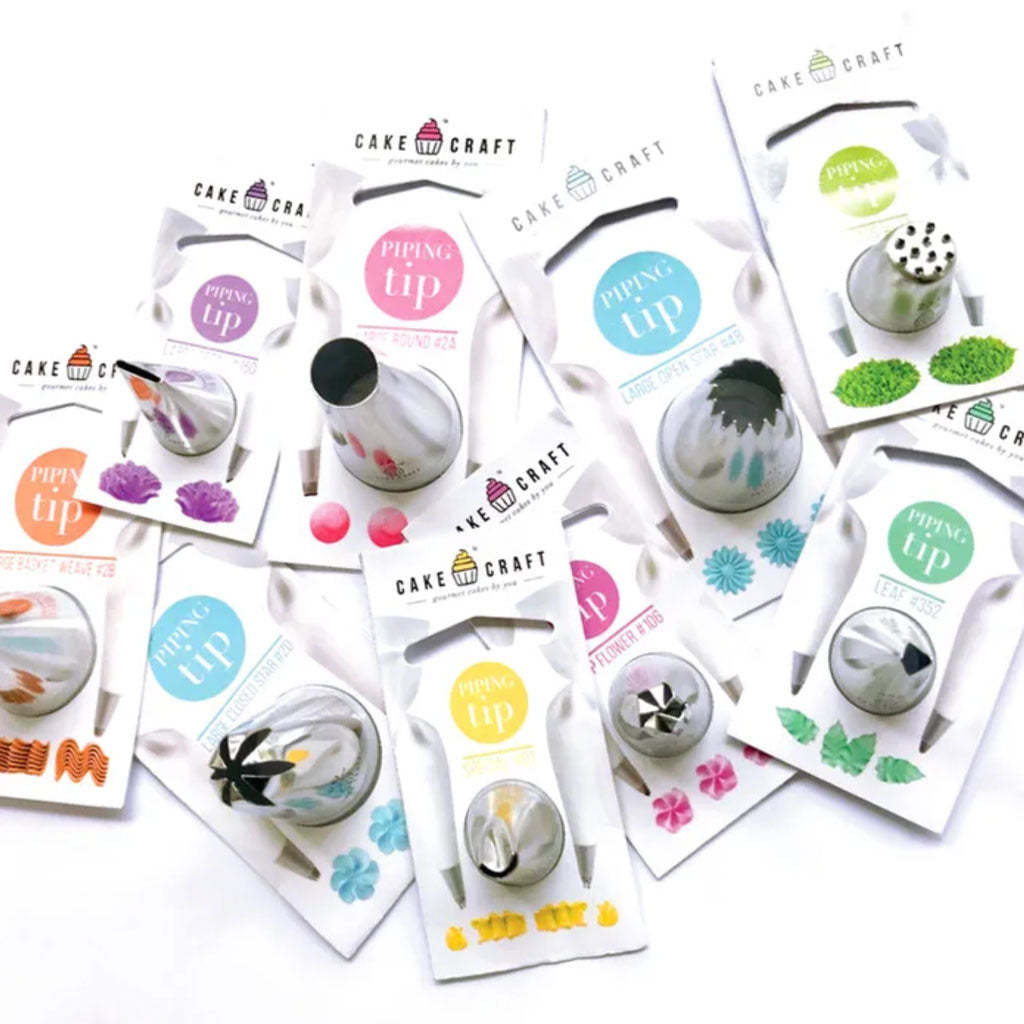 a collection of cake craft piping tips laid out
