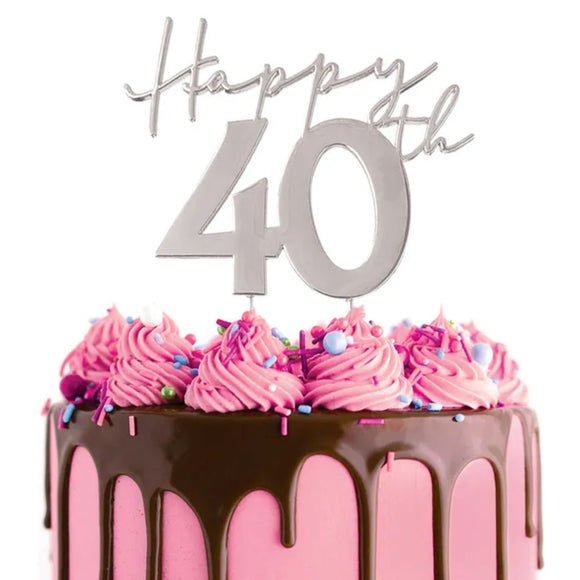 Cake Craft Happy 40th Silver Metal Cake Topper placed on a pink cake with chocolate cake drip