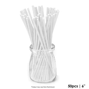 white paper pop sticks in clear glass jar
