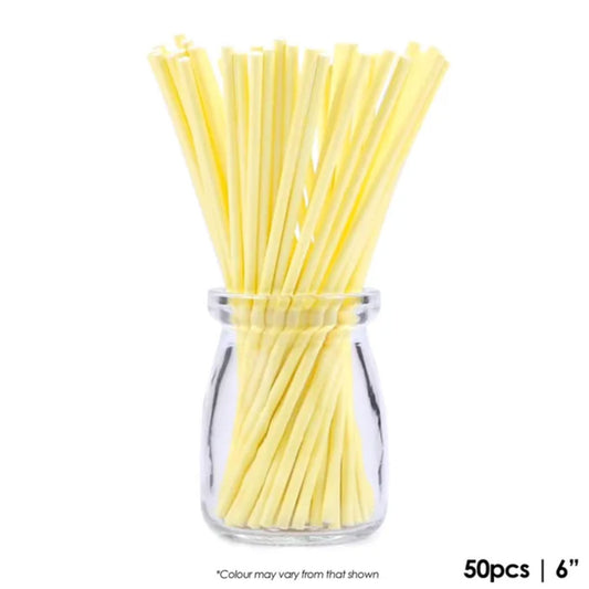 cake craft yellow paper pop sticks in glass jar