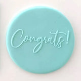 congrats pattern from debosser on round circle of blue fondant