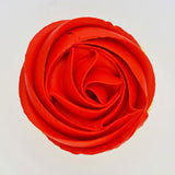 red buttercream rose piped on to a muffin using the gobake bright red gel colour