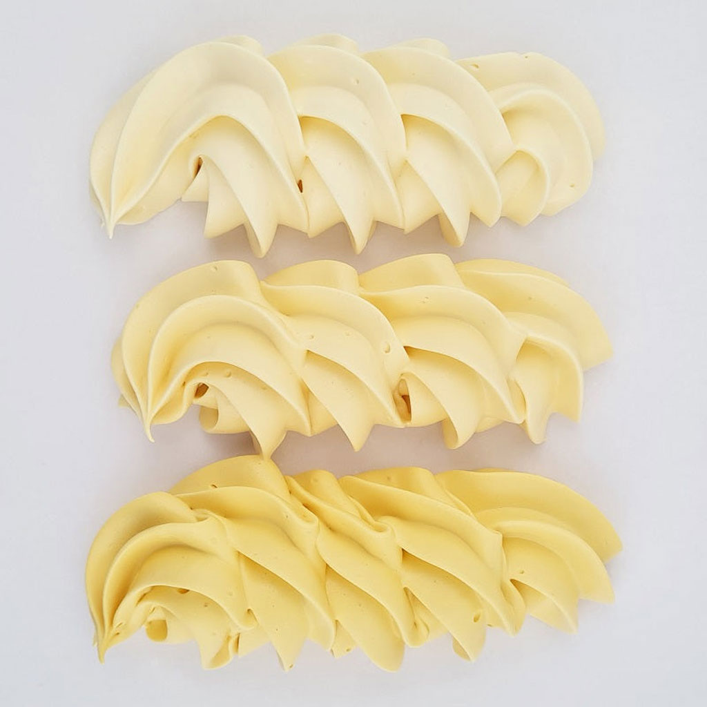 buttercream colour examples of the buttercream yellow gel colour on a white background