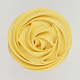 green buttercream rose piped on to a muffin using the gobake buttercream yellow gel colour