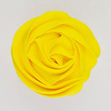 yellow buttercream rose piped on to a muffin using the gobake canary yellow gel colour