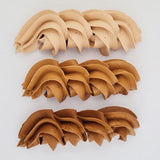 buttercream colour examples of the chocolate brown gel colour on a white background