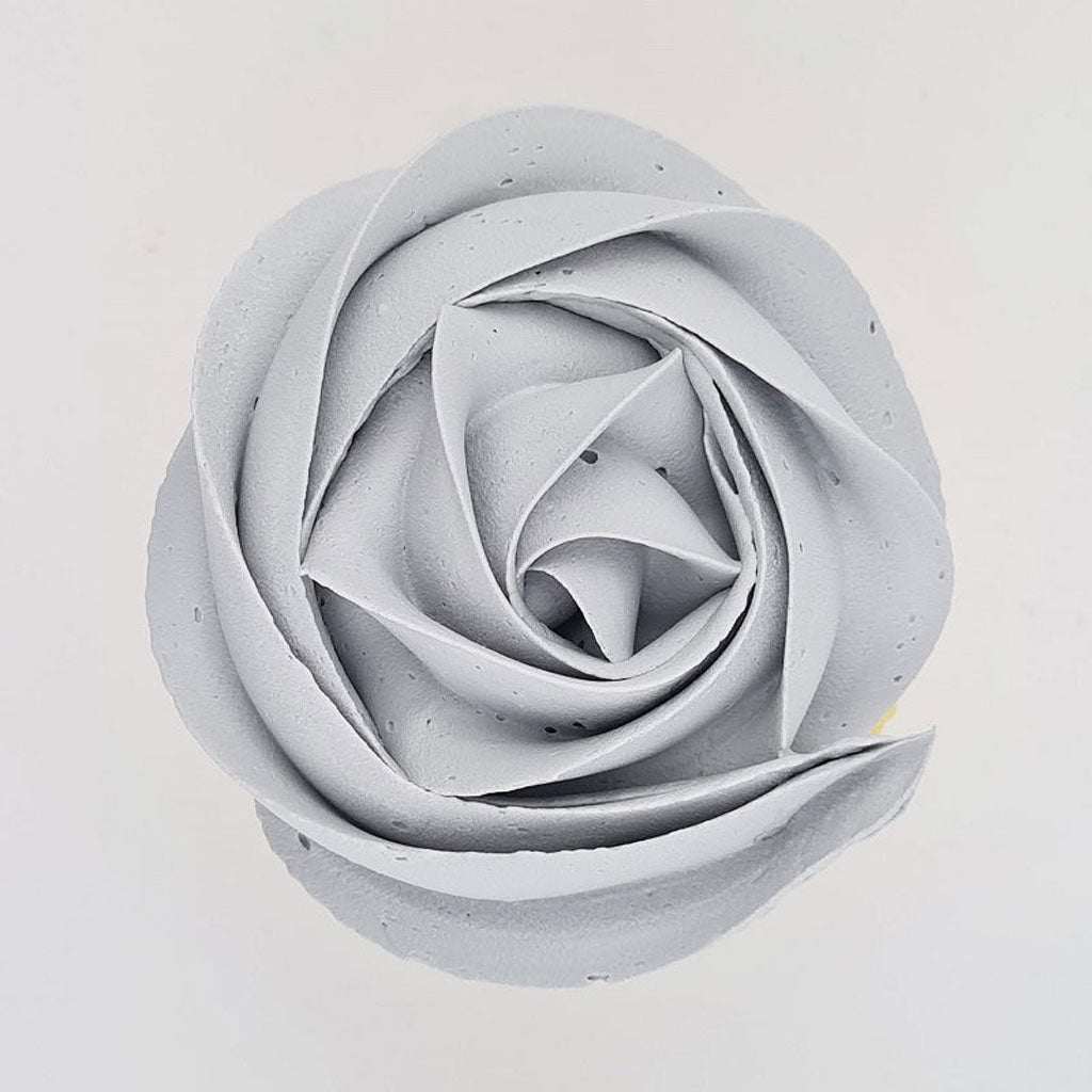 grey buttercream rose piped on to a muffin using the gobake concrete grey gel colour