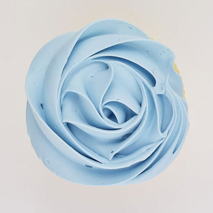 blue buttercream rose piped on to a muffin using the gobake duck egg blue gel colour