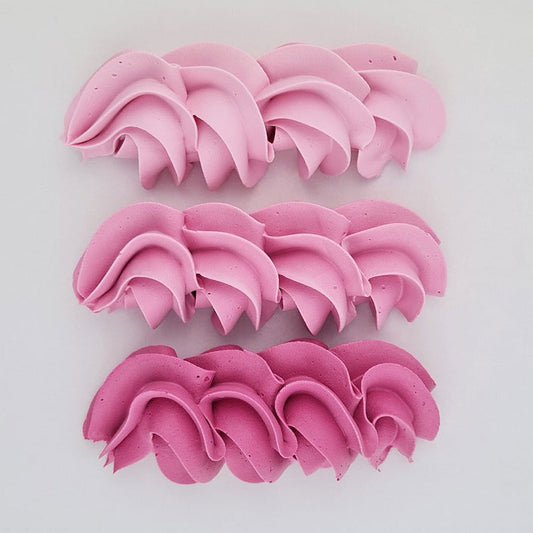 buttercream colour examples of the fuchsia pink gel colour on a white background