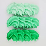 buttercream colour examples of the Kelly green gel colour on a white background