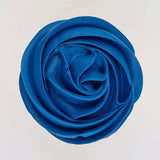 blue buttercream rose piped on to a muffin using the gobake navy blue colour