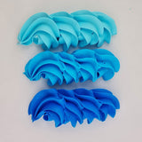 buttercream colour examples of the neon blue gel colour on a white background