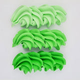 buttercream colour examples of the neon green gel colour on a white background