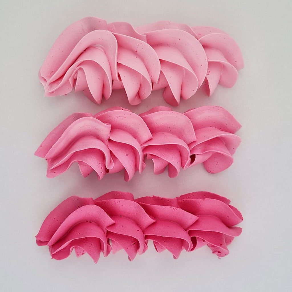 buttercream colour examples of the pink Charlotte gel colour on a white background