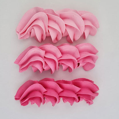 buttercream colour examples of the pink Charlotte gel colour on a white background