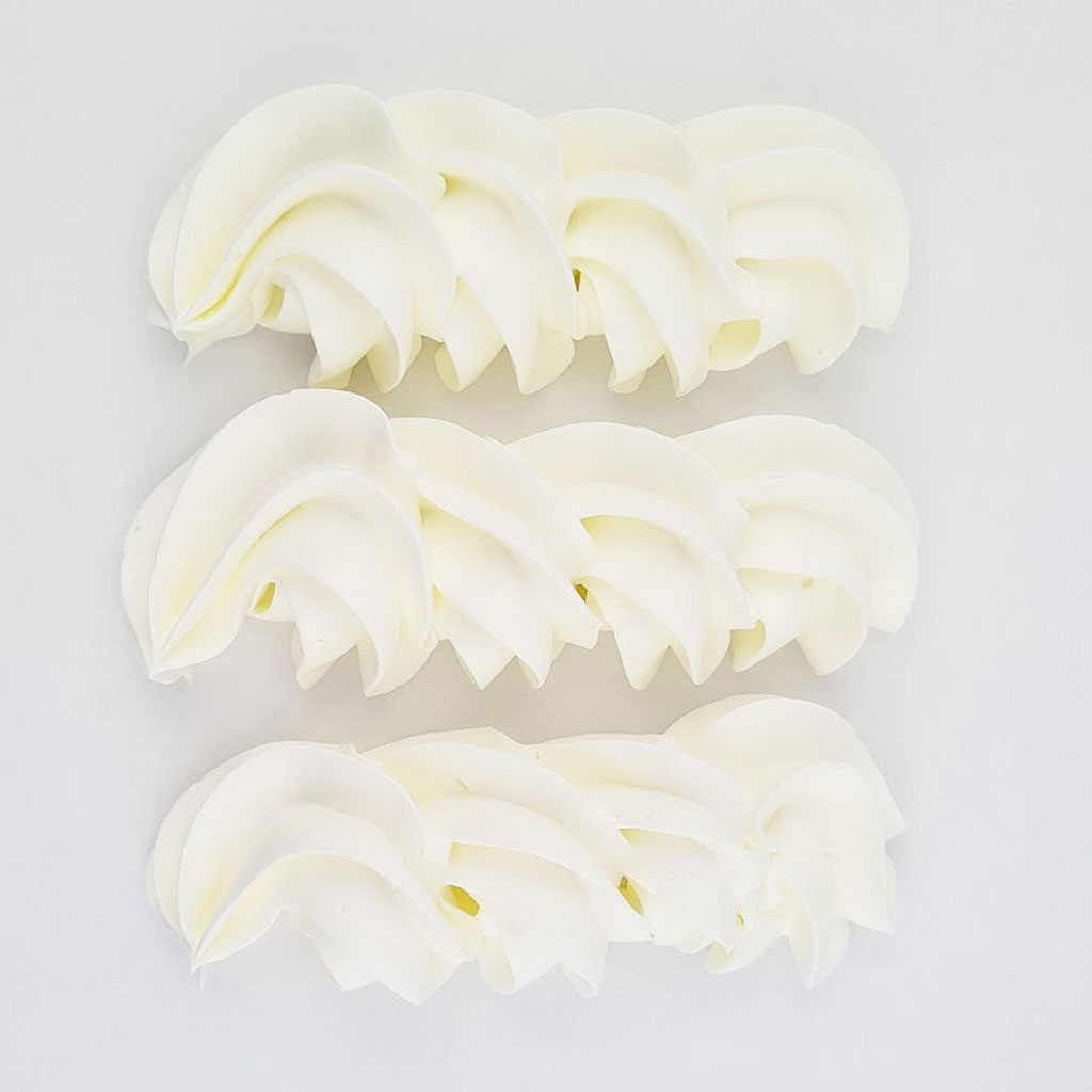 buttercream colour examples of the super white gel colour on a white background