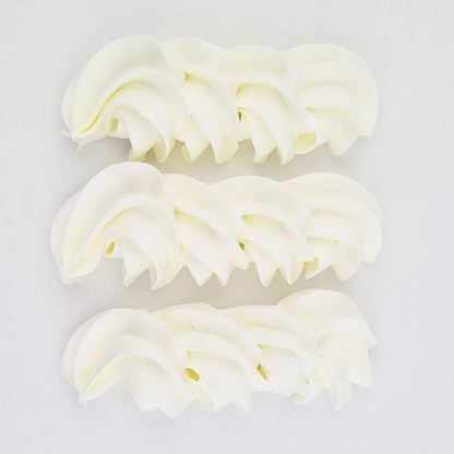 buttercream colour examples of the super white gel colour on a white background