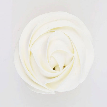 white buttercream rose piped on to a muffin using the gobake super white gel colour